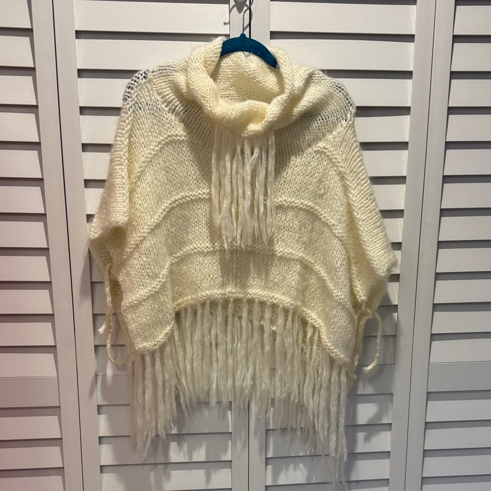 Elegant knitted Cream Knit Poncho with Fringe